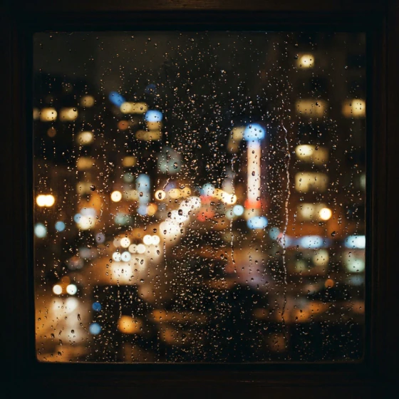 A rainy window with blurred city lights, made with Nano Banana Lite in Pictory