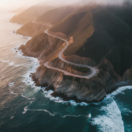 A coastal road along cliffs at sunrise, an example of a shot to make with Veo 3.1 in Pictory