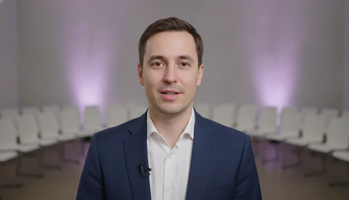 A conference host in an event highlight reel made from a keynote recording, with the moments ticked off