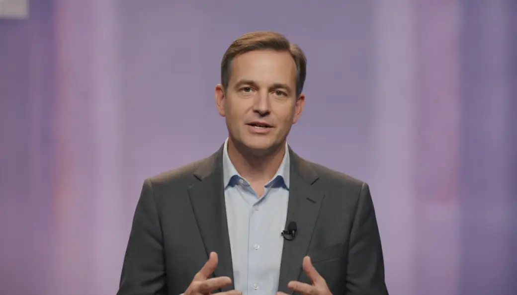 A conference speaker in a captioned one-minute summary video Pictory made from his long talk
