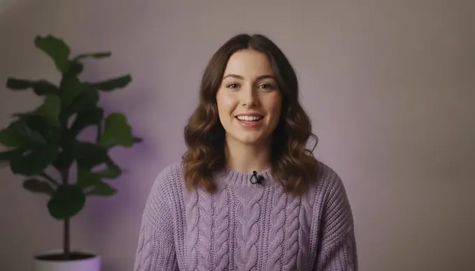 A course creator in her home studio in an online course video with a quiz