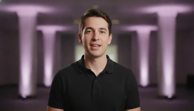 An event organizer in a clip cut from a keynote recording