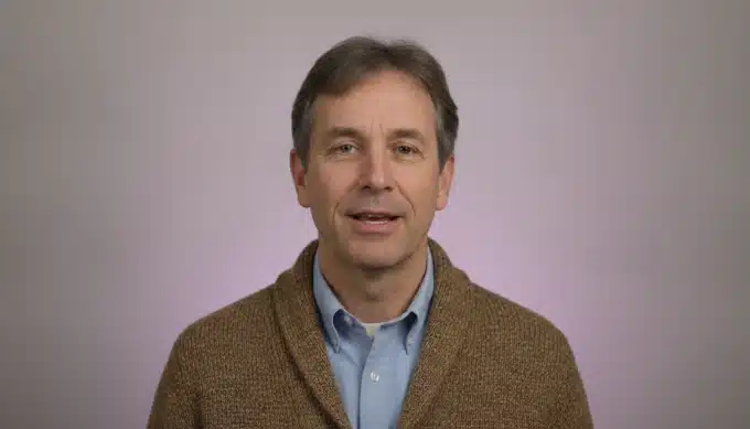 A history teacher in a classroom in a lesson video with captions added by Pictory