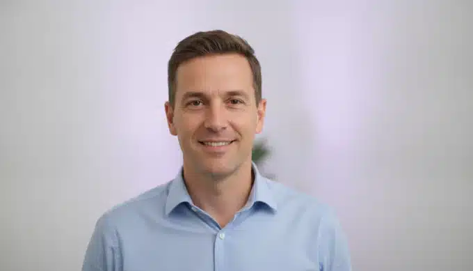 A marketing lead in a bright office in a launch video made from an AI-written script