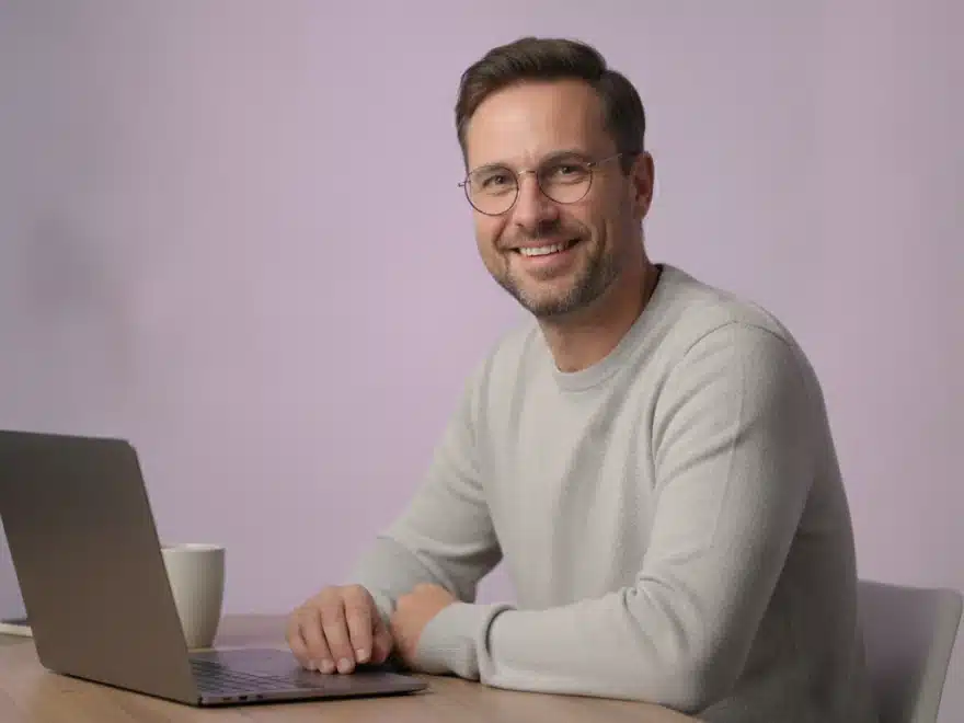 A marketing manager at his desk fixing a product name in the captions of a video in Pictory