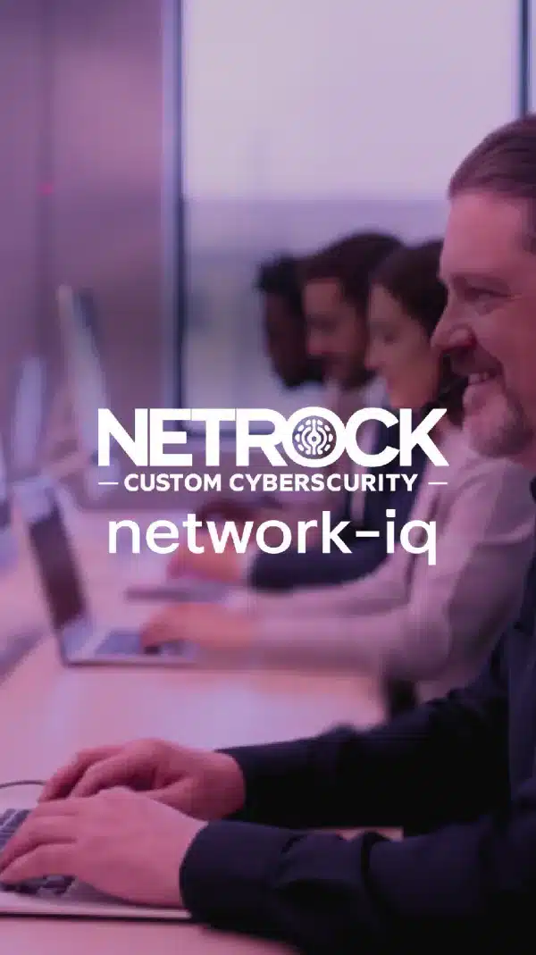 NetRock Custom Cybersecurity logo over a team working at their computers