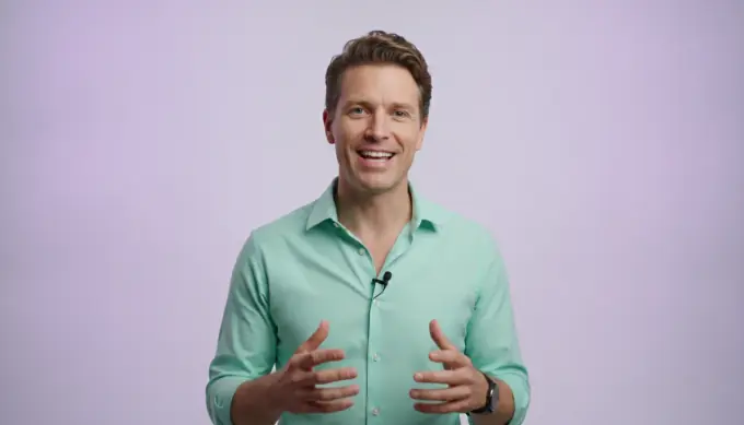 A product marketer speaking to camera in a studio, in a product update video made from a slide deck
