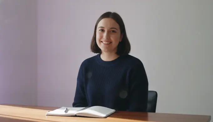 A software product marketer at her desk in a product demo video