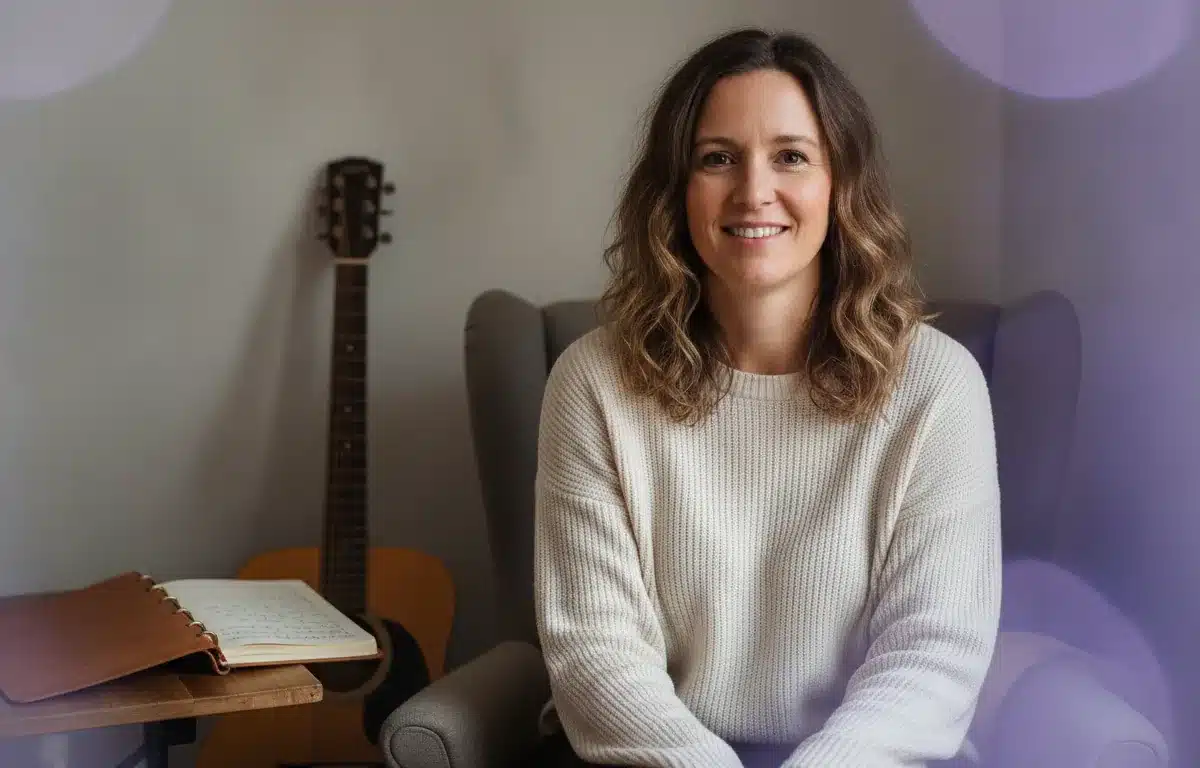 Songwriter with her notebook and guitar after making a lyric video for her song in Pictory