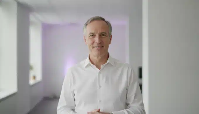 A training manager in an office in a scenario story video for staff training