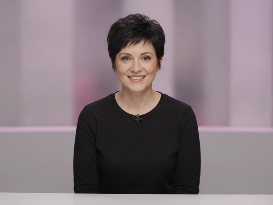 Video producer at her desk choosing an AI voice for the avatar in her Pictory video