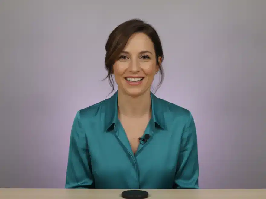 A webinar host at her desk after removing filler words and silences from her recording in Pictory